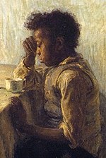 African-American boy at a table with a hand against his head