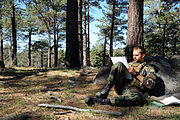 Third Phase A student plots coordinates on his map during an individual land navigation exercise in Mount Laguna.