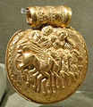 Jupiter and Minerva riding a quadriga drawn by pegasi on a 4th-century BC gold Etruscan bulla, Museo Gregoriano Etrusco
