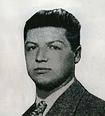 Head and shoulders photograph of Morris Cohen wearing a jacket and tie