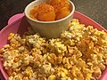 Mandarin oranges and popcorn, both sprinkled in Tajín