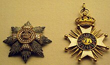 Two jeweled star-burst medallions. One is heavily crusted with carved gold and small gold beads; the other has carved gold, with a central jewel.