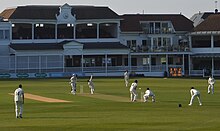 A colour photo of a cricket match in progress at the St Lawrence cricket ground in Canterbury