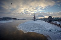 Sunset over an ice-covered Neva River