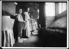 A regular worker (doffer) in Richmond Spinning Mills. Photo during working hours. Chattanooga, Tenn. Lewis Hine 1910