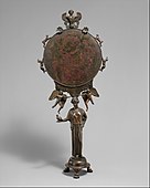 Mirror with a support in the form of a draped woman; mid-5th century BC; bronze; height: 40.41 cm; Metropolitan Museum of Art