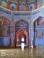 Arches off of the central prayer chamber are decorated with blue Sindhi tiles