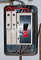 MEM rewirable fuse box with four rewirable fuse holders (two 30 A and two 15 A) installed c. 1957 (cover removed)