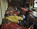 Members of the WAAF repair and pack parachutes for use by airborne troops during the Normandy invasion, 31 May 1944.
