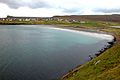 The inlet Sandsvágur and the sandy beach after which the village is called. This is the only beach on the Faroe Islands with dunes and beach grass.
