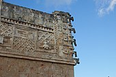 Uxmal, Nunnery building, frieze with stacked rain god snouts at corner, Late Classic