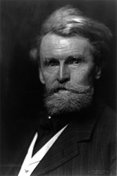 Left-looking half-length portrait of a bearded man of about 60