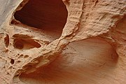 Permian sandstone wall near Sedona, Arizona, United States, weathered into a small alcove