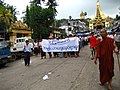 Image 40Protesters in Yangon with a banner that reads non-violence: national movement in Burmese, in the background is Shwedagon Pagoda. (from History of Myanmar)