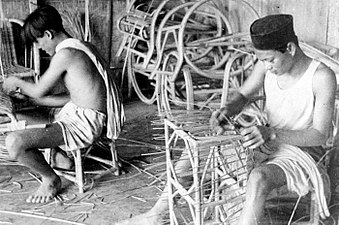 Indonesians making rattan furniture, circa 1948