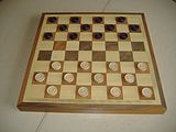 8x8 board, starting position in Italian and Portuguese draughts