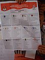 An election official holding up a ballot paper during the vote count