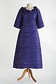 Lavender evening gown in pleated linen with 3/4 length sleeves and a frilled neckline by Sybil Connolly