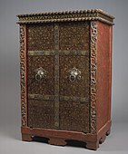 18th century cabinet, lacquer and gilding on wood, iron. The decoration includes skulls and skeletons.