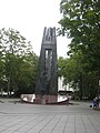 Monument to Vincas Kudirka in Vilnius is topped by Columns of Gediminas.