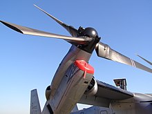 A closeup of an MV-22B's rotor and engine tilted slightly upward.