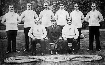 The City of London Police tug of war team that won the gold medal at the Olympic Games in 1908. (Back row - left to right): Frederick Merriman, John James Shepherd, Edwin Mills, Albert Ireton, Frederick Goodfellow, Frederick Humphreys (Front row - left to right): Edward Barrett, Henry Duke[a], William Hirons