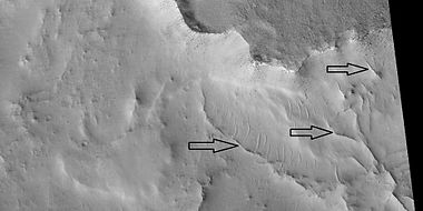 Ridges near the previous image of a ridge network, as seen by HiRISE under HiWish program. Arrows point to some ridges.