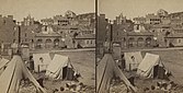 Contraband camp at Harpers Ferry, Virginia (now West Virginia), about 1861. Note John Brown's Fort in background.