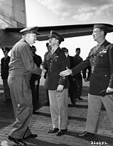 General Marshall greets Major General John R. Deane and Brigadier General Stuart Cutler while arriving at Potsdam, Germany on 15 July 1945.
