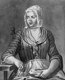 A engraving based on a painting of a young woman in poor clothing and a bonnet, sitting on a chair, holding a rabbit in her lap. Her right elbow is supported by a table as she looks to the left, a neutral expression on her face.