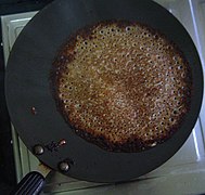 Methi dosa on a pan, known as vendhyam dosai in Tamil Nadu