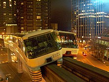 Nighttime view of two monorail cars that collided with each other on a gauntlet track