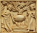 An ivory casket carving showing Tristan and Iseult next to a fountain (1340–50) (The Louvre)