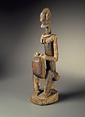 Figure of a seated musician (koro player); late 18th century; 55.8 x 17.7 x 10.8 cm (22 x 7 x 41⁄4 in.); Brooklyn Museum (New York City)