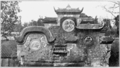 A Temple in Yong-hien, the city below the Great Buddha in 1910. Notice the two chimneys in the foreground.