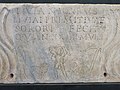 Plaque of the sarcophagus of Livia Primitiva. The text is Livia Primitiva dead at 24 years and 9 months old, regreted by her sister Livia Nicarus. The image of Good Shepherd surrounded by His sheep, presence of a fish and an anchor show the belonging to the Christian community.