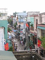 A street in Da Nang, Vietnam. Flags are being displayed on the occasion of Reunification Day, a national holiday