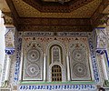 Decoration on the outer wall of the mausoleum, with a grilled window to the tomb (bottom center) where prayers can be offered to Idriss II