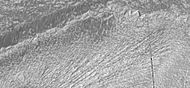 Close-up of grooves left by a glacier, as seen by HiRISE under HiWish program. The presence of grooves suggest that it was a wet-based glacier. Moisture under the glacier may have helped Martian organisms to survive.