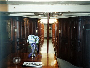 Coronet interior, hallway. Note curvilinear woodwork and etched mirror to left.