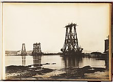 Black and white photograph of the construction of the cantilevers of the Forth Bridge