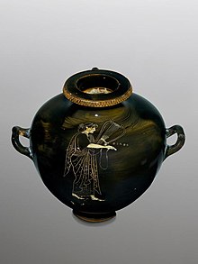 black vase with an image of a woman playing the lyre
