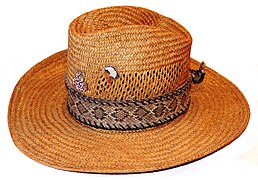 A Texas straw hat with the ornament made of a rattlesnake's skin