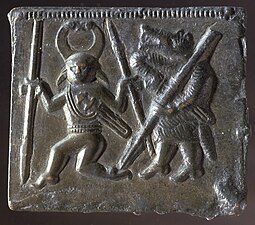 Animal headed warrior and a one eyed character on one of the Torslunda plates.