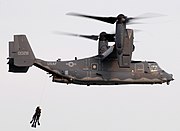 SEALs being hoisted into a CV-22 Osprey from the Air Force's 8th Special Operations Squadron during a joint training exercise.