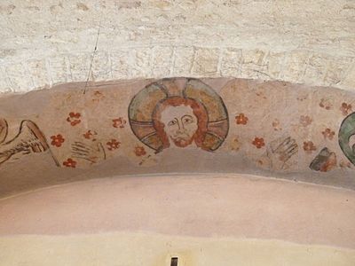 Trace of a fresco of Christ at the top of the arch