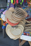 Pamaypay or paypay, traditional heart-shaped hand fans from the Philippines woven from buri palm