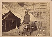 Photograph taken about 1862 of a contraband servant named John Henry in a Union Army Camp.[19]