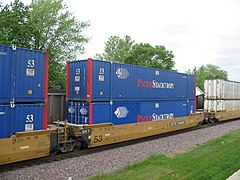 North American container train services often employ double-stacked container cars, as here in Rochelle, Illinois.