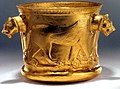 A Hyrcanian Achaemenid golden cup depicting lions without manes and fully exposed ears in the sculpted heads used as handles, but manes suggested in engraving on the body. Dated first half of first millennium. Excavated at Kalardasht in Mazandaran, Iran.